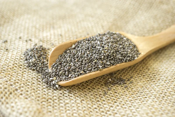 Chia seeds in a wooden scoop