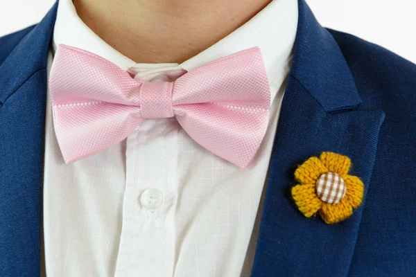 Man in blue suit bowtie, pocket square