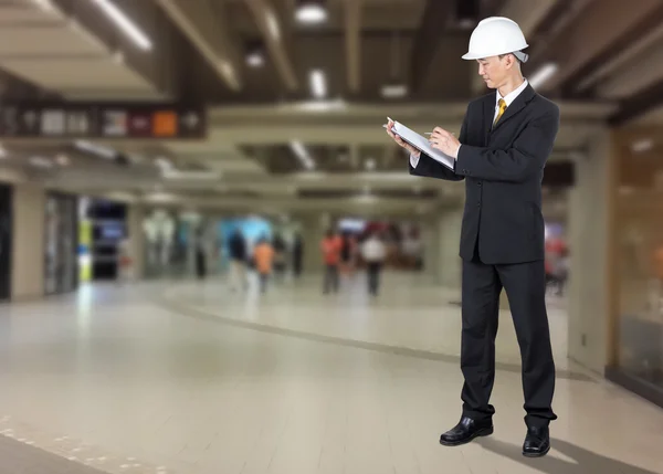 Asian Engineer checking list form of construction for safety