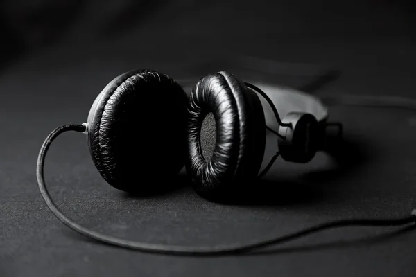 Black headphones on a black background