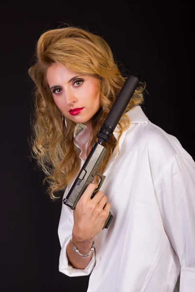 Sexy blonde woman with rifle