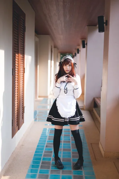 Charming Asian girl in japanese maid costume