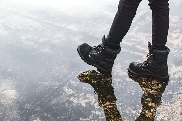 Girl wearing jeans and black combat boots