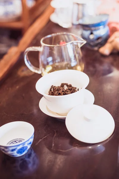 A cup of whole leaf lapsang souchong tea, a rich smoky flavored tea