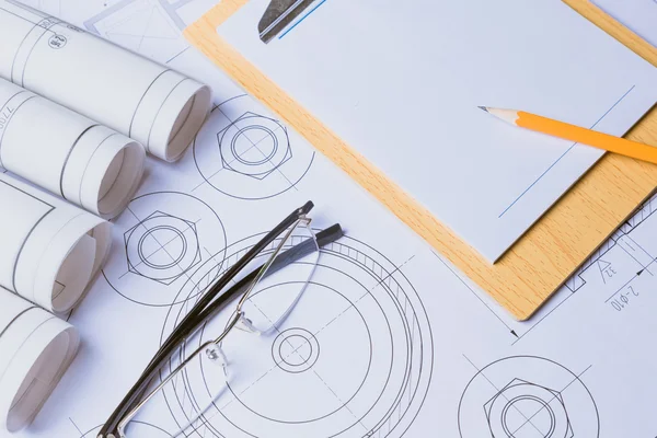 Ruler eraser glasses and a pencil on the floor plan Bussines a