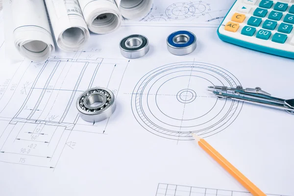 Construction drawings slide caliper roller bearings on blueprint architecture and building concept.