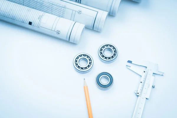 Construction drawings slide caliper roller bearings on blueprint architecture and building concept.