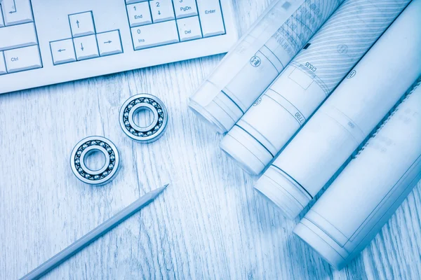 Construction drawings slide caliper roller bearings on blueprint architecture and building concept.
