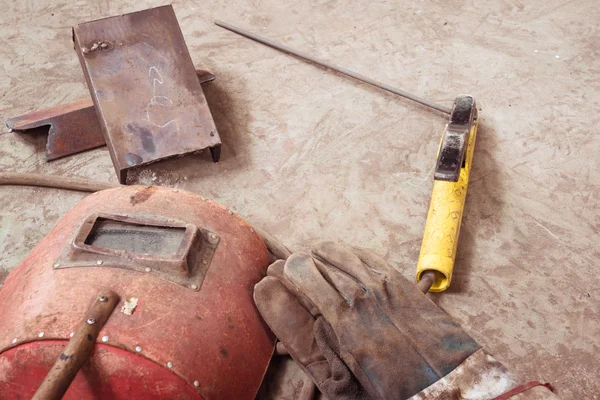 Electric welding machine, electric wire, masks, gloves and tongs, are very old