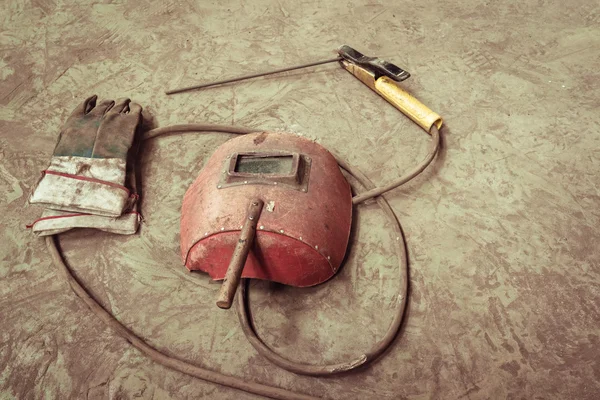 Electric welding machine, electric wire, masks, gloves and tongs, are very old
