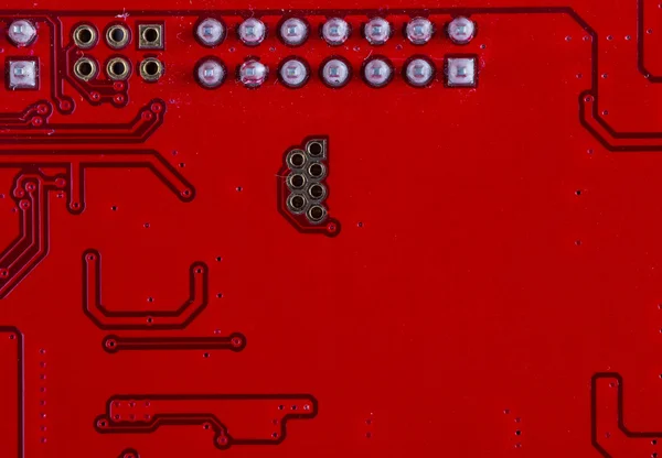 Close up of a printed red computer circuit board