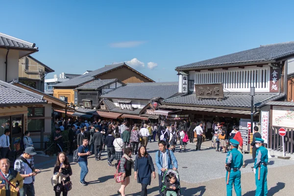 Tourists walk on a street around Kiyomizu Temple