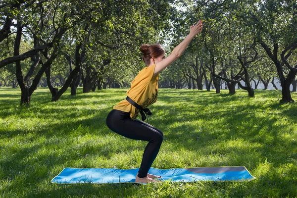 Yoga exercises in green park