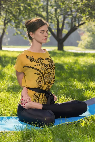 Yoga exercises in green park