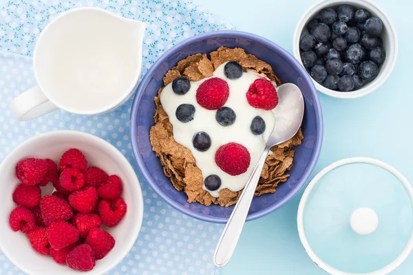 A Healthy Bran Flakes Breakfast With Berries And Yoghurt.