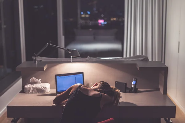 Teenage girl sleeping at the desk