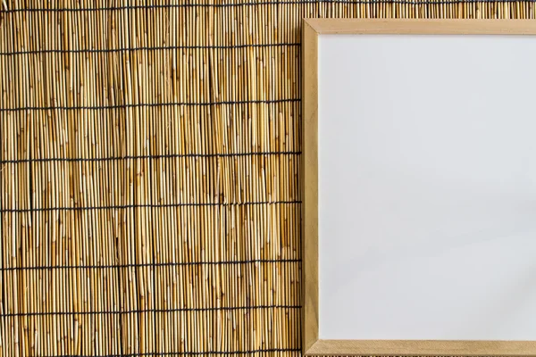 Whiteboard with bamboo blind background