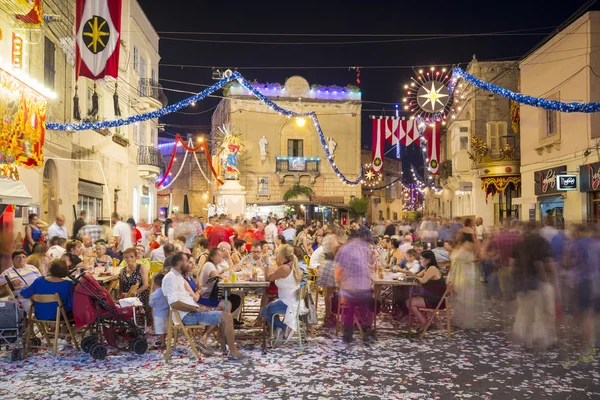 Mosta, Malta - 15 Aug. 2016: The Mosta festival at night with celebrating maltese people.