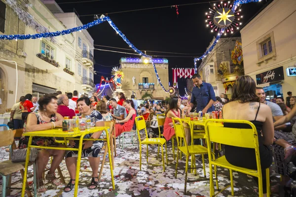 Mosta, Malta - 15 Aug. 2016: The Mosta festival at night with celebrating maltese people.