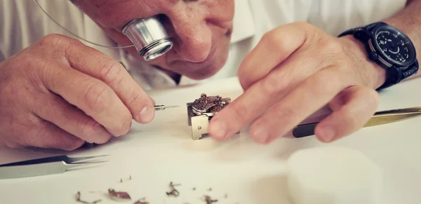 Watchmaker making luxury handmade watch