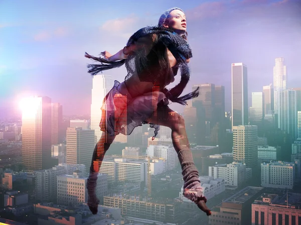 Woman jump over the city - concept