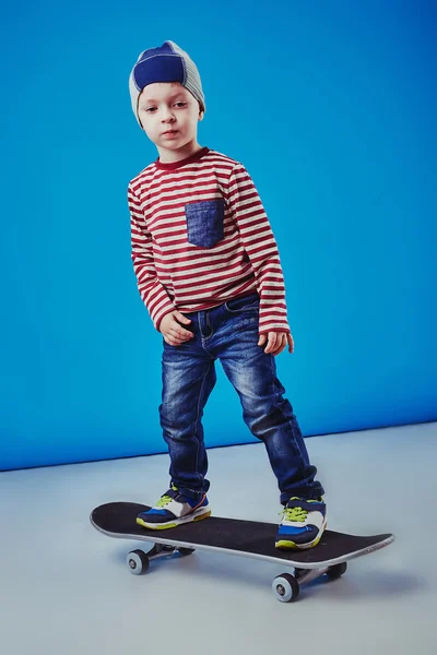 Happy boy riding skateboard