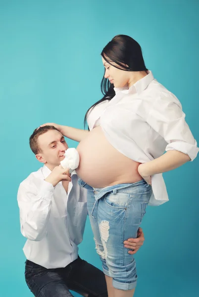 Indoor portrait of beautiful asian pregnant woman and her husband