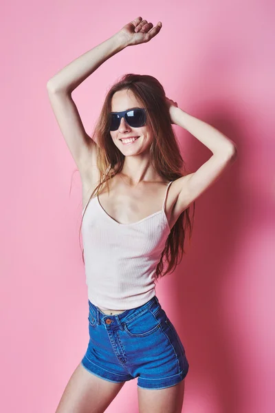 Fashion portrait of blonde girl with sunglasses wearing pastel stylization