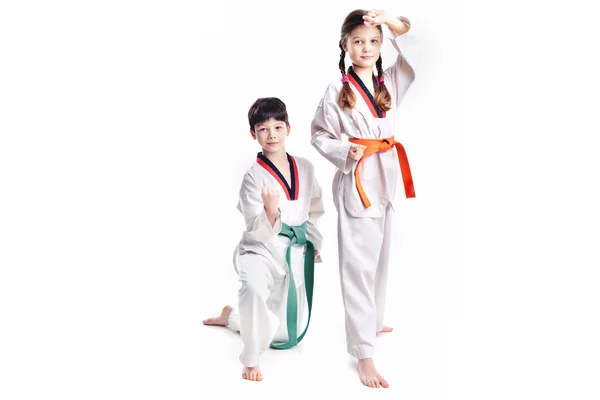 Two children athletes martial art taekwondo training