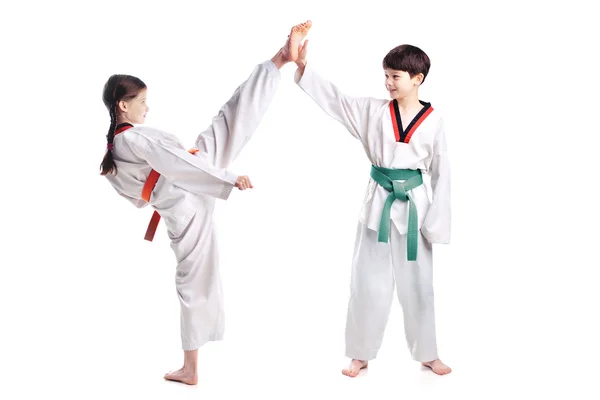 Two children athletes martial art taekwondo training