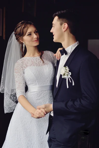 Emotional wedding couple in cafe having fun together.