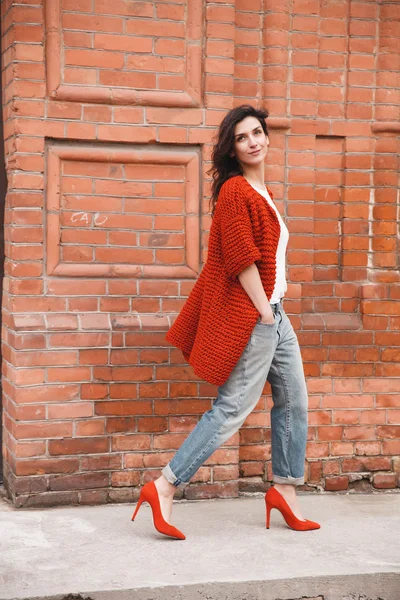 Woman wearing knitted colorful coat outdoor