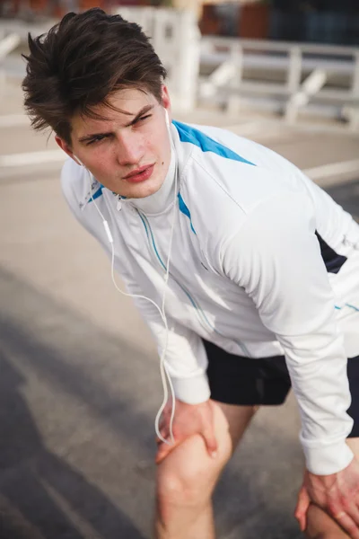 Athlete taking rest after urban running