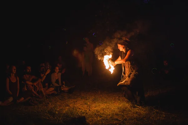 Woman spiritual dance with fire at Avatar Yoga Festival