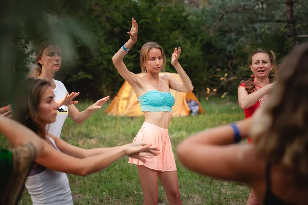 Outdoor woman dancing practice during Avatar Yoga Festival