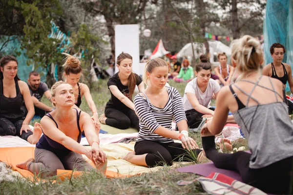 Outdoor woman practice during Avatar Yoga Festival