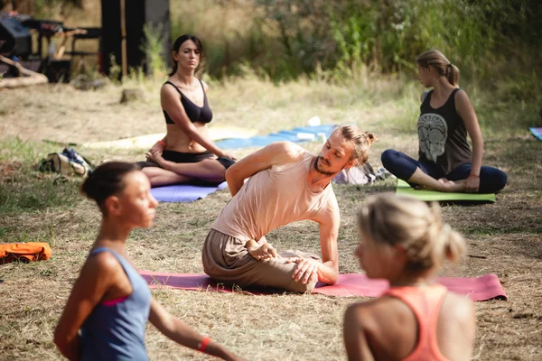 Outdoor woman practice during Avatar Yoga Festival