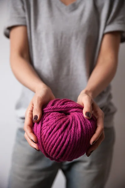 Yarn ball in female hands