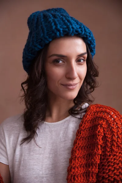 Portrait of young woman wearing knitted clothes