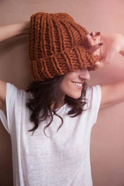 Happy smiling woman in knitted hat