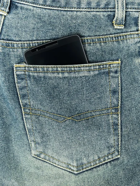 Smart phone in jeans pocket