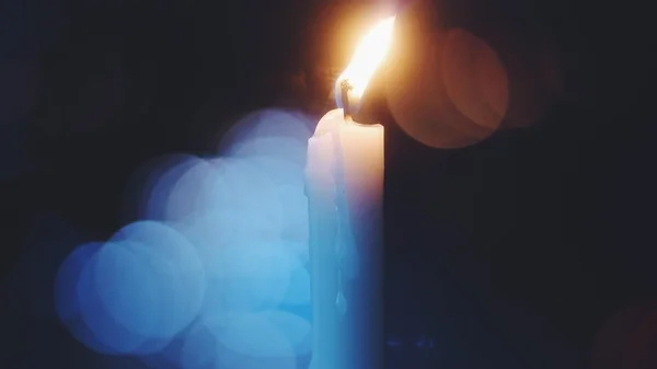 Burning white candle