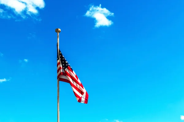 Flag of United States of America with sky.