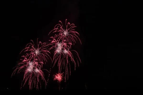 Fireworks over the city celebrate in happy festival.