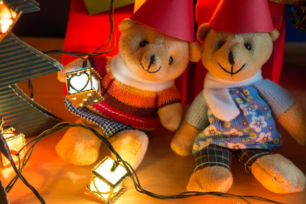 Ornament and teddy bear, Christmas decorate at Merry Christmas night light. Christmas tree and other decoration with Lovely gift and ribbon