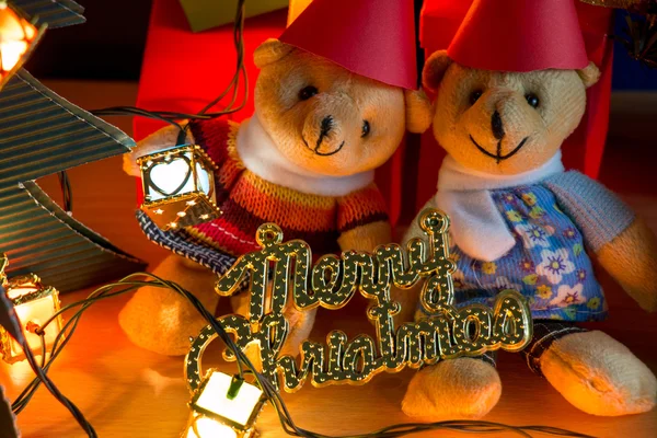 Ornament and teddy bear, Christmas decorate at Merry Christmas night light. Christmas tree and other decoration with Lovely gift and ribbon