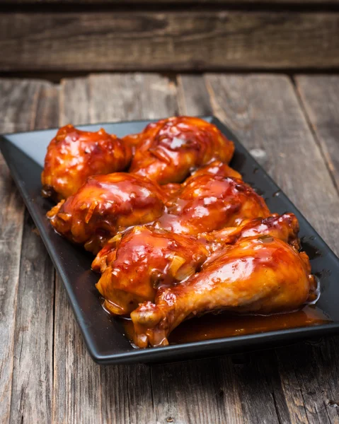 Chicken drumsticks in a sweet and sour sauce