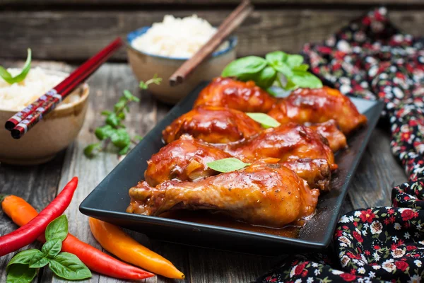 Chicken drumsticks in a sweet and sour sauce