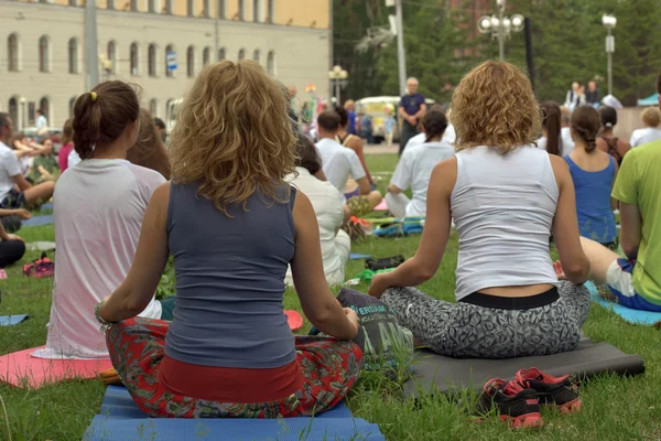 TOMSK RUSSIA - JUNE 19, 2016:: Residents of the city are taking part in the open lesson on Yoga in Central Park