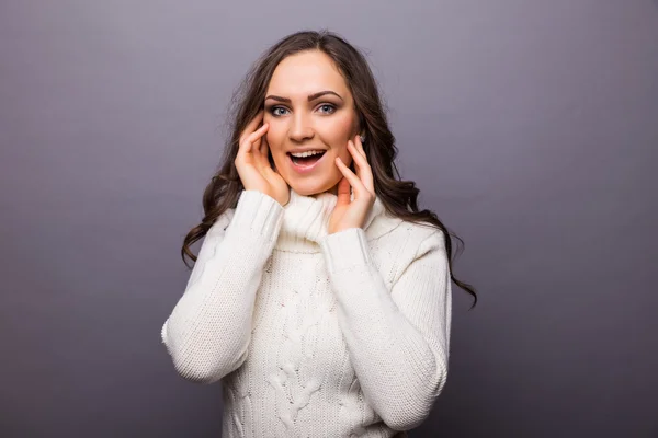 Beautiful face of young adult woman with hands on face